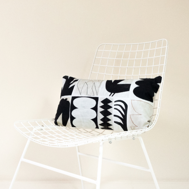 Rectangular Modernist printed cushion composed of black graphic shapes