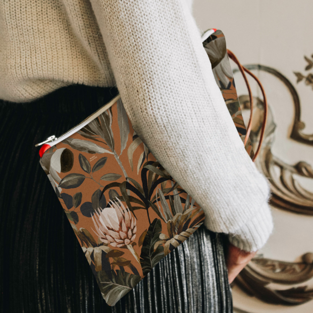 Our long zippered pouch can be slipped into your handbag or worn as an evening clutch