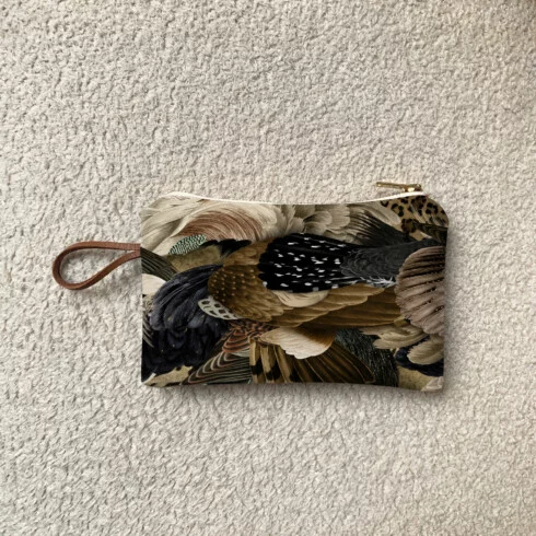 Mini zipped fabric pouch with a unique Sauvage N°27 bird feather design