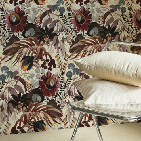Floral printed wall tapestry in burgundy tones on an ecru background