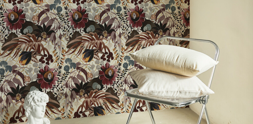 Floral printed wall tapestry in burgundy tones on an ecru background