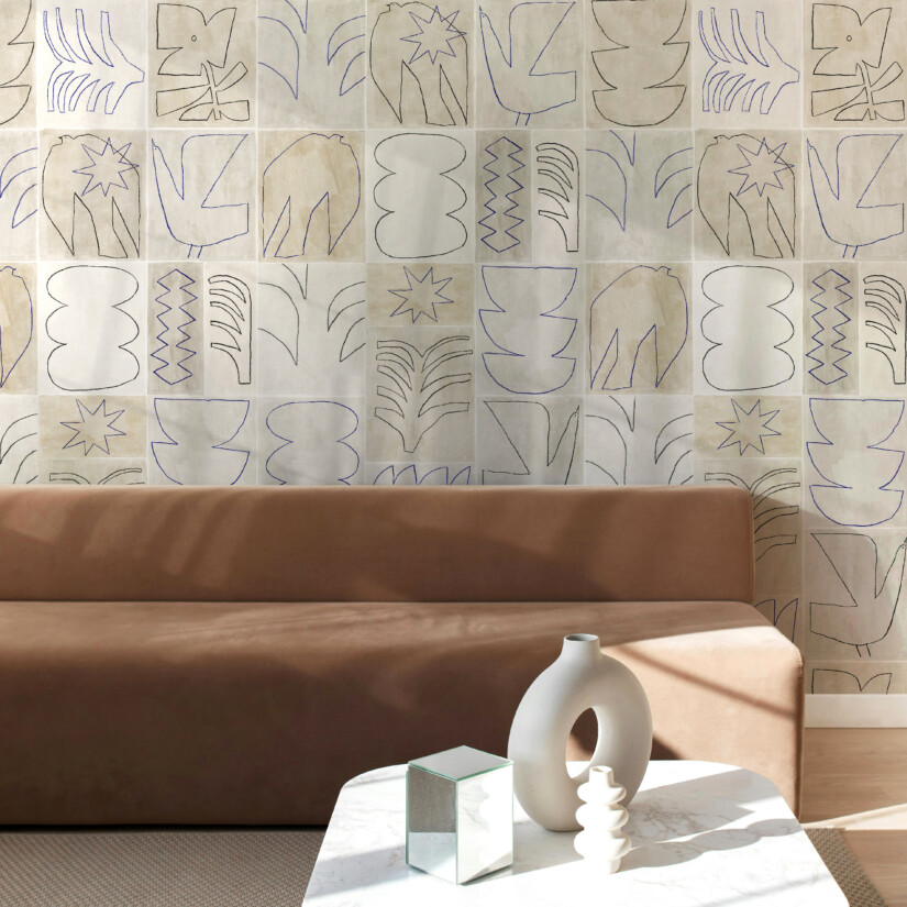 Patchwork wallpaper with various blue and black chalk drawings