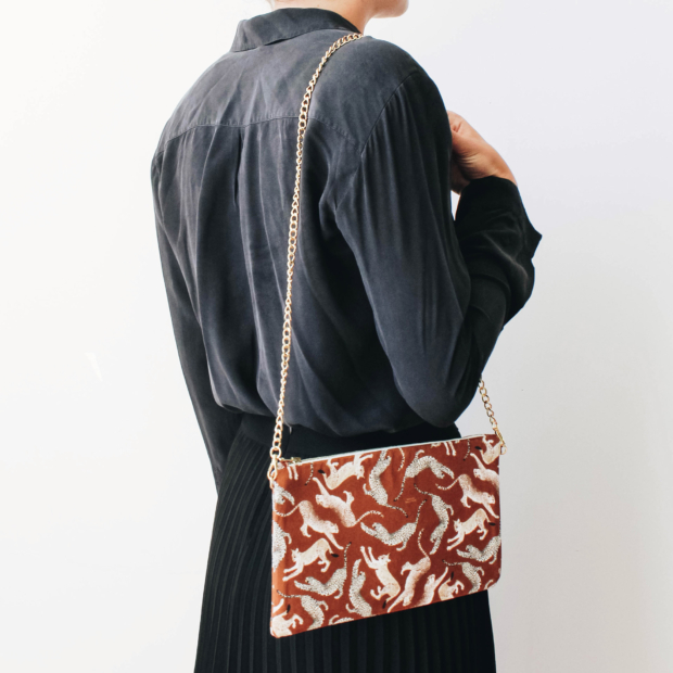 Adopt an elegant style with this animal print evening clutch